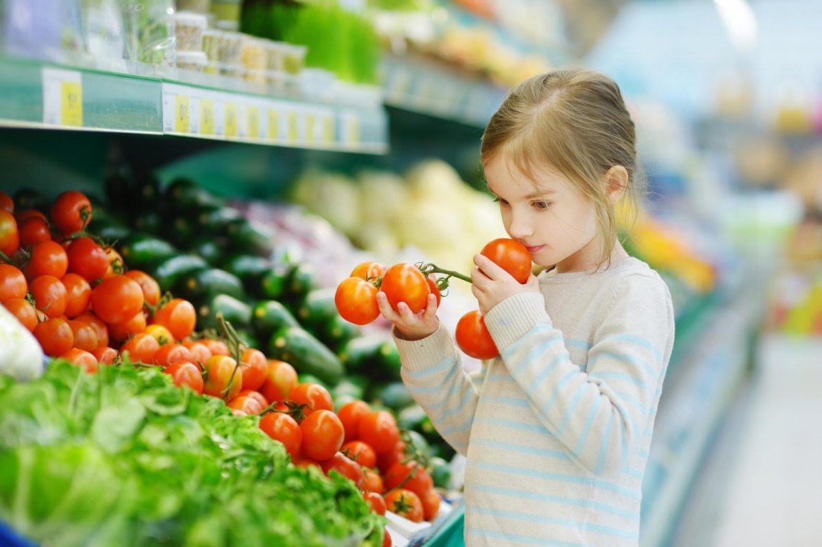 Child in a supermarket tomato aisle — the case for greenhouses in education